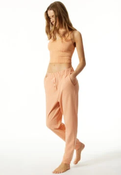 Schiesser Lounge Pants Long Tencel Sustainable Pockets Cuffs Decorative Buttons Peach - Lounge Refibra -Uni Style Shop loungehose lang tencel nachhaltig taschen buendchen zierknoepfe pfirsich lounge refibra 176937 612 front